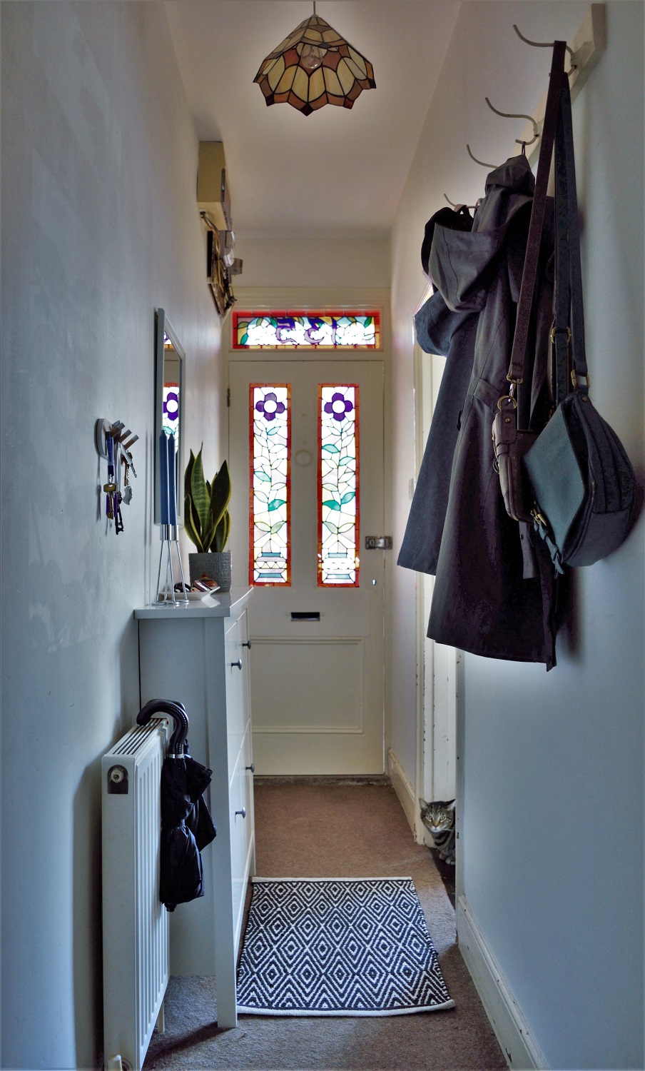 Victorian entry hallway with stained glass door