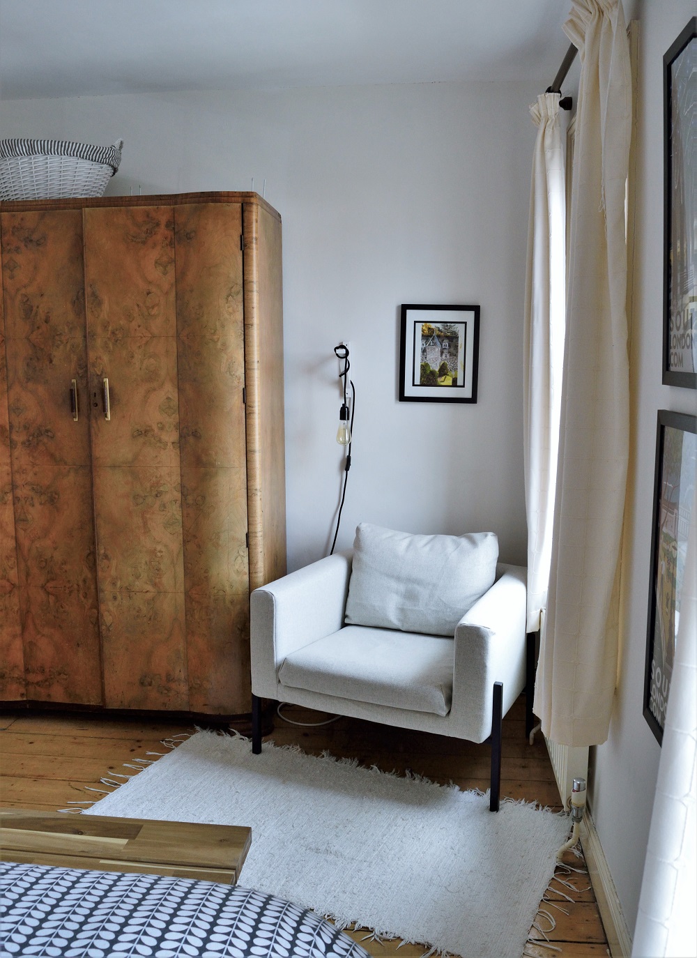 Ikea Koarp armchair next to wardrobe