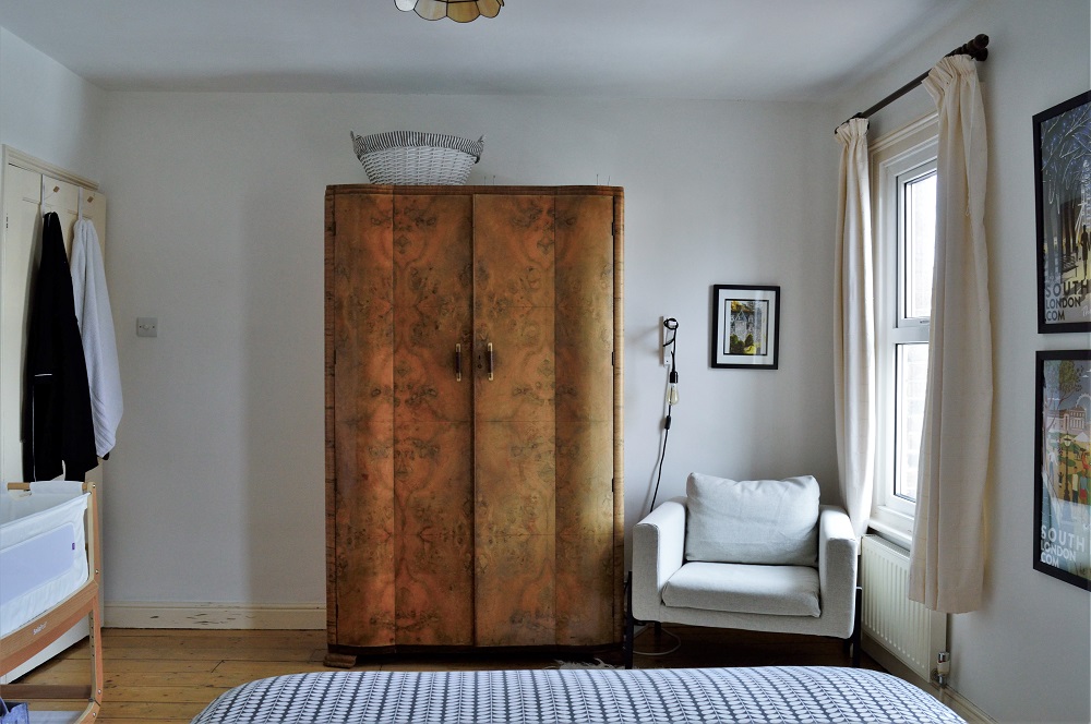 Ikea Koarp armchair next to wardrobe