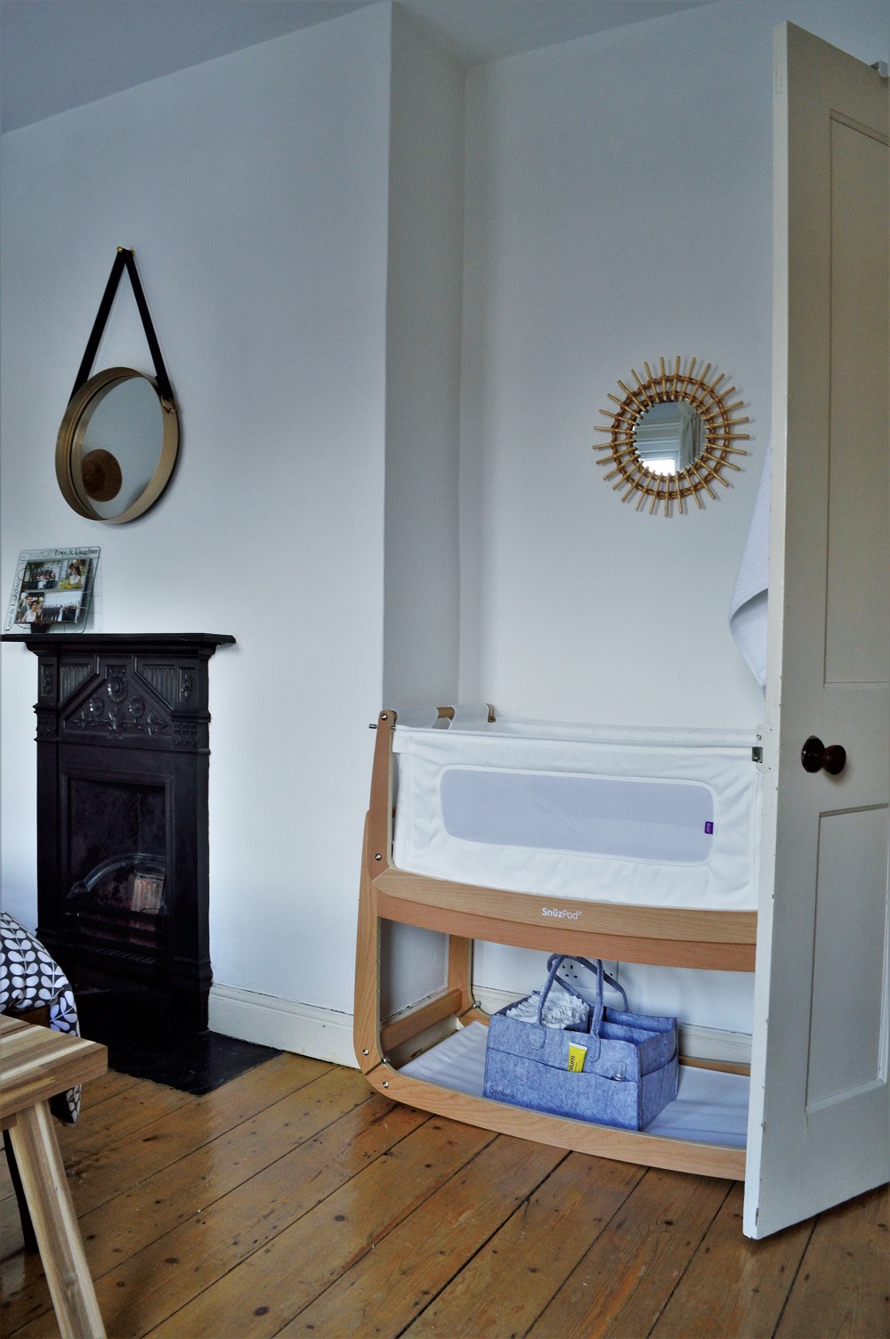 Minimalist master bedroom with SnüzPod bedside crib